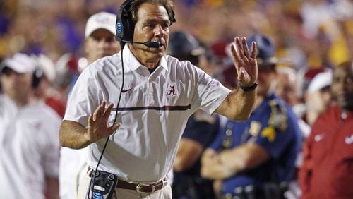 Alabama coach Nick Saban tries to get the referee’s attention as the play clock approaches zero in the second half at LSU on Nov. 5. Alabama won 10-0. (AP Photo/Gerald Herbert)