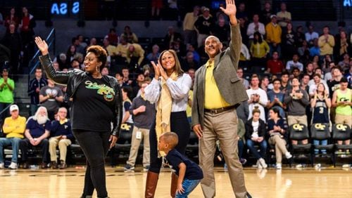 Former Georgia Tech basketball player Harvey Webb, who became the first black player at Tech, was honored at the Yellow Jackets’ Feb. 21 game against N.C. State at McCamish Pavilion. Webb was joined by niece Sakari Balam (left), daughter Fonda Martin and grandson Pierce Martin. (GT Athletics/Danny Karnik)