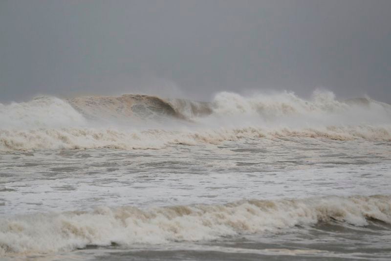 The surf kicks up from approaching Hurricane Michael in Panama City Beach, Fla., Wednesday, Oct. 10, 2018. (AP Photo/Gerald Herbert)