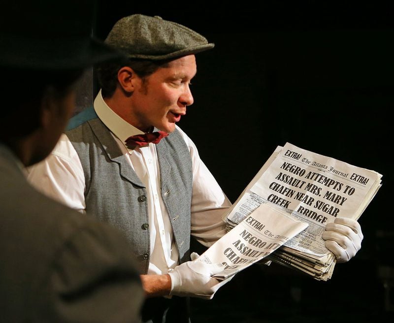 Actor Tim Batten portrays a newspaper boy hawking The Atlanta Journal on a street corner scene during the new interactive play “Four Days of Fury Atlanta 1906” based on the events leading up to and following the Atlanta race violence of that year at the Atlanta History Center on Sunday, Feb. 17, 2013, in Atlanta. CURTIS COMPTON / CCOMPTON@AJC.COM