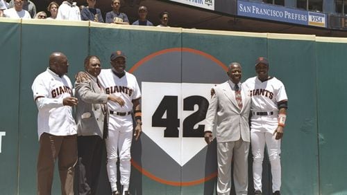 (Left to right) Vida Blue, Willie Mays, Dusty Baker, Hank Aaron and Barry Bonds stand next to a #42 sign in memory of Jackie Robinson prior to the Atlanta Braves 5-2 win over the San Francisco Giants at 3Com Park in San Francisco, California, on June 7, 1997.