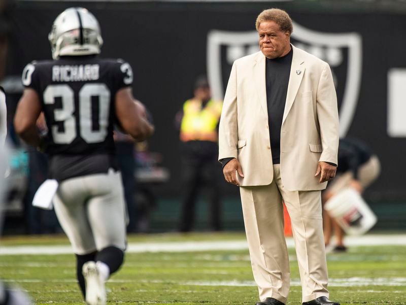 Raiders general manager Reggie McKenzie watches running back Jalen Richard (30) warm up before a game against the Pittsburgh Steelers on Sunday, Dec. 9, 2018. He is no longer with the team. (Hector Amezcua/Sacramento Bee)