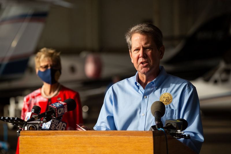 Georgia Gov. Brian Kemp and Georgia Department of Public Health (DPH) Commissioner Dr. Kathleen Toomey speak at the Peachtree Dekalb Airport in Atlanta, Georgia, on Thursday, July 1, 2020. Governor Kemp and Georgia Department of Public Health (DPH) Commissioner Dr. Kathleen Toomey will take part in a “Wear a Mask” Flyaround Tour of Georgia, encouraging Georgians to follow the guidance of public health officials to stop the spread of COVID-19 ahead of the 4th of July Weekend. (REBECCA WRIGHT FOR THE ATLANTA JOURNAL-CONSTITUTION)