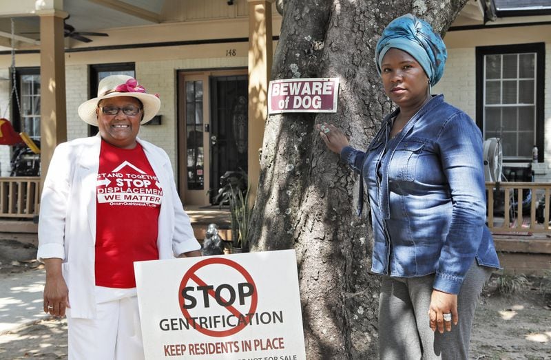 September 12, 2019 - Atlanta - Peoplestown residents Bertha Darden (left) Tanya Washington in front of Washington’s home. For the past five years, Peoplestown residents have been in an ongoing legal battle with Atlanta after the city attempted to take their properties through eminent domain. The city approved a proposal that would allow them to purchase the homes located near a flood zone and convert the land into a reservoir and park. Since then efforts to seize the four remaining properties that sit on a stretch of Atlanta Avenue it southeast Atlanta have stalled. Bob Andres / robert.andres@ajc.com