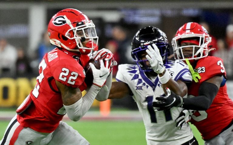 Georgia Bulldogs defensive back Javon Bullard (22) intercepts a pass intended for TCU Horned Frogs wide receiver Derius Davis (11) during the first half of the College Football Playoff National Championship at SoFi Stadium in Los Angeles on Monday, January 9, 2023. (Hyosub Shin / Hyosub.Shin@ajc.com)