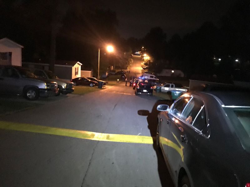 Gwinnett County police  investigate a Wednesday night fatal shooting at Smokecreek mobile home park in unincorporated Snellville.  (Credit: Channel 2 Action News)