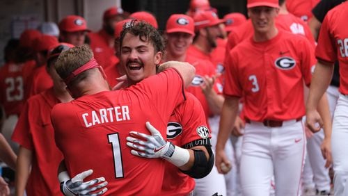 Kolby Branch (9) of Georgia celebrates his grand slam in the second inning in the game against University of North Carolina Wilmington at Foley Field Saturday June 1, 2024 in Athens. The Bulldogs won 11-2. (Nell Carroll for The Atlanta Journal-Constitution)