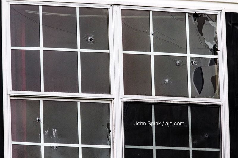 A home in the 5600 block of One Lake Way was riddled with bullets in retaliation for a triple shooting that left two teens dead and another injured, South Fulton police said. JOHN SPINK / JSPINK@AJC.COM