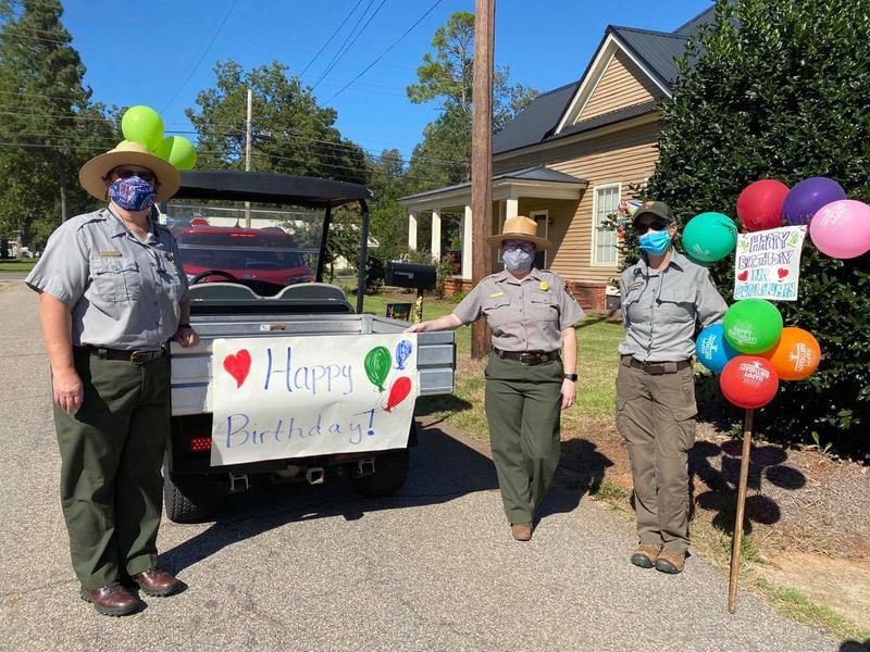 Rangers at the Jimmy Carter National Historic Site in Plains prepare to drive by Jimmy Carter's house for a parade.