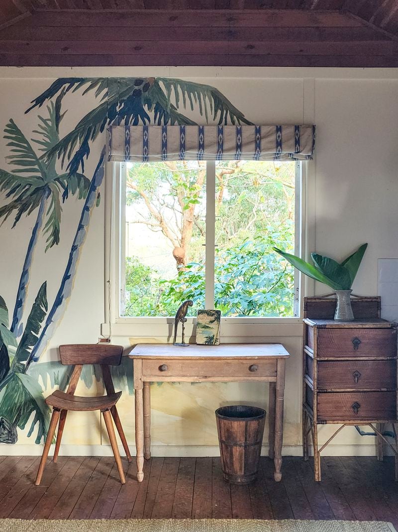 Want to bring the ocean vibe inside? Interior designer Ingrid Weir advises using art, as with this palm tree mural she based on a thrift store painting.
(Courtesy of Ingrid Weir)