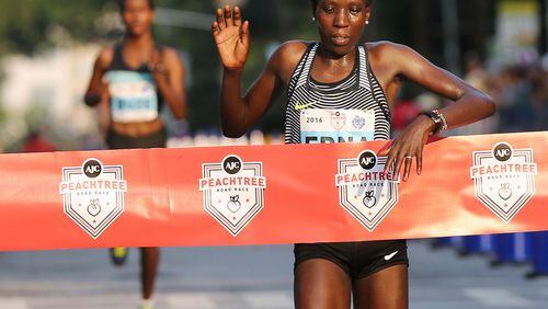 070416 ATLANTA: Edna Kiplagat is the first female finisher in the 47th running of the AJC Peachtree Road Race at Piedmont Park on Monday, July 4, 2016, in Atlanta. Curtis Compton / ccompton@ajc.com