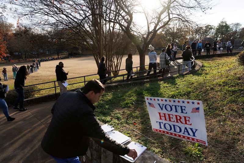 The nonprofit Informing Democracy organization this week released a report that identified more than 200 state and local election officials who “exhibited anti-democratic tendencies or actions” ahead of the 2022 vote. Pictured are Georgia voters wait to cast their ballots outside a polling location at the Bessie Branham Recreation Center in Atlanta on Dec. 2, 2022. (Dustin Chambers/The New York Times)