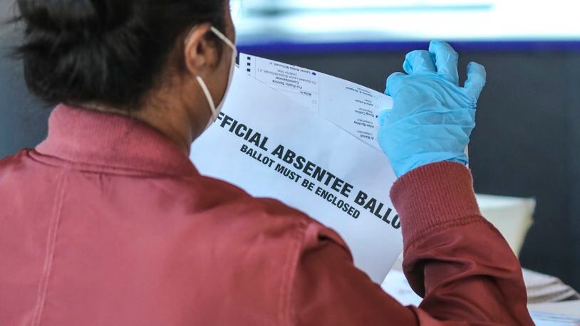 Fulton County election workers started counting and scanning ballots again on Wednesday Nov. 4, 2020 as the State and the Nation waited for the results. (John Spink / John.Spink@ajc.com)