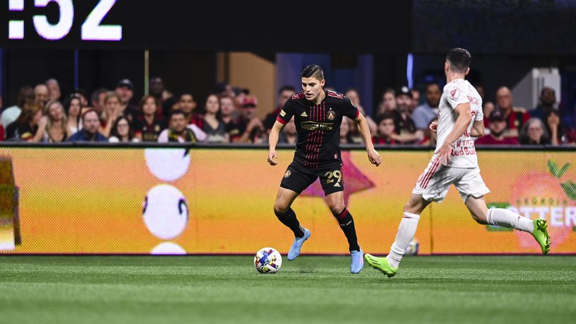 Atlanta United forward Ronaldo Cisneros #29 dribbles th ball during the match against New York Red Bulls at Mercedes-Benz Stadium in Atlanta, United States on Wednesday August 17, 2022. (Photo by Mitchell Martin/Atlanta United)