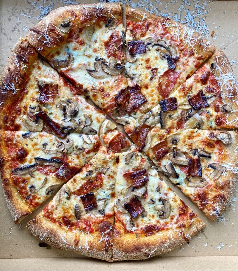 La Calavera’s Homeboy pie is made on a whole-wheat crust with mushrooms, Spotted Trotter pepperoni and Pulp chili oil. Bacon also was added to this pizza. Wendell Brock for The Atlanta Journal-Constitution