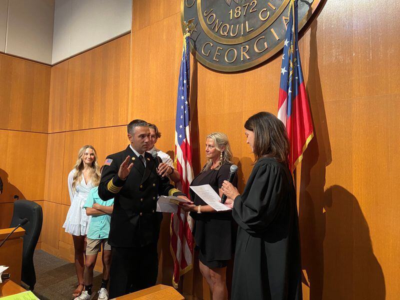 Smyrna Fire Chief Brian Marcos was sworn-in during Monday’s City Council meeting with his wife, Ashley, and three children by his side and a crowd cheering afterwards in council chambers. Courtesy city of Smyrna