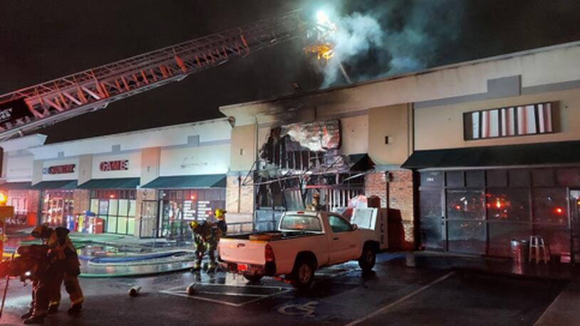 The blaze gutted the business at the Norcross strip mall.