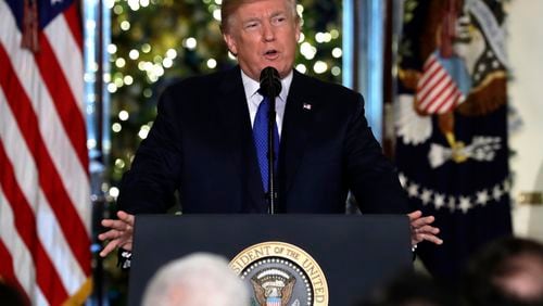 President Donald Trump speaks on tax reform in the Grand Foyer of the White House, Wednesday, Dec. 13, 2017, in Washington. (AP Photo/Evan Vucci)