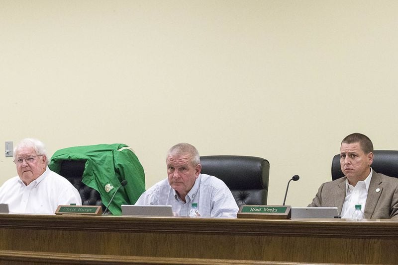 Buford Commission Chairman Phillip Beard (from left), Vice Chairman L. Chris Burge (center) and Comissioner Bradley W. Weeks (right) performs their duties during the final Buford City Commission meeting of the year at the Buford City Hall building in Buford, Monday, December 3, 2018. (ALYSSA POINTER/ALYSSA.POINTER@AJC.COM)