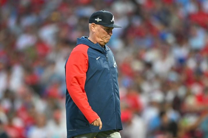Atlanta Braves manager Brian Snitker walks back to the dugout after a pitching change against the Philadelphia Phillies during the third inning of NLDS Game 3 in Philadelphia on Wednesday, Oct. 11, 2023.   (Hyosub Shin / Hyosub.Shin@ajc.com)