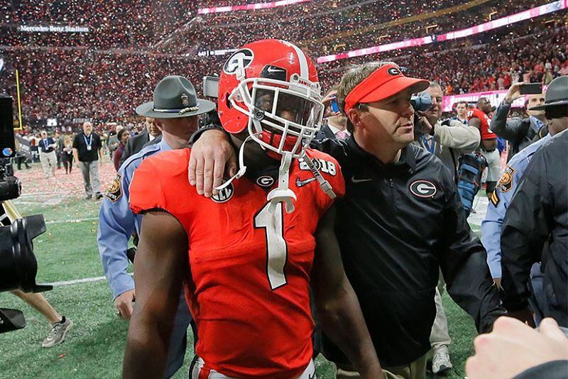 Georgia Bulldogs running back Sony Michel (1) and head coach Kirby Smart walk off after the loss. The Georgia Bulldogs played the Alabama Crimson Tide in the BCS Championship at Mercedes-Benz Stadium in Atlanta. (Bob Andres/AJC)