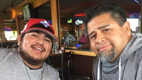Symon Castillo, left, is pictured with his father, Nate Castillo, on Father's Day, less than two weeks before the June 30, 2017, fall that killed him. Symon, 22, saved his father's life through a kidney donation after his death.