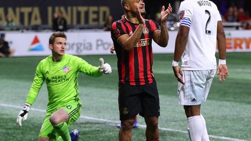 Atlanta United midfielder Josef Martinez applaudes his team’s effort after a new miss against FC Cincinnati goalkeeper Spencer Richey during the first half in their MLS soccer match on Sunday, March 10, 2019, in Atlanta.    Curtis Compton/ccompton@ajc.com