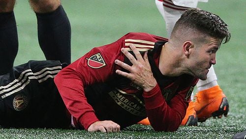 Atlanta United defender Greg Garza goes down with an injury and leaves the game against the New York Red Bulls during the second half Sunday, May 20, 2018, in Atlanta.
