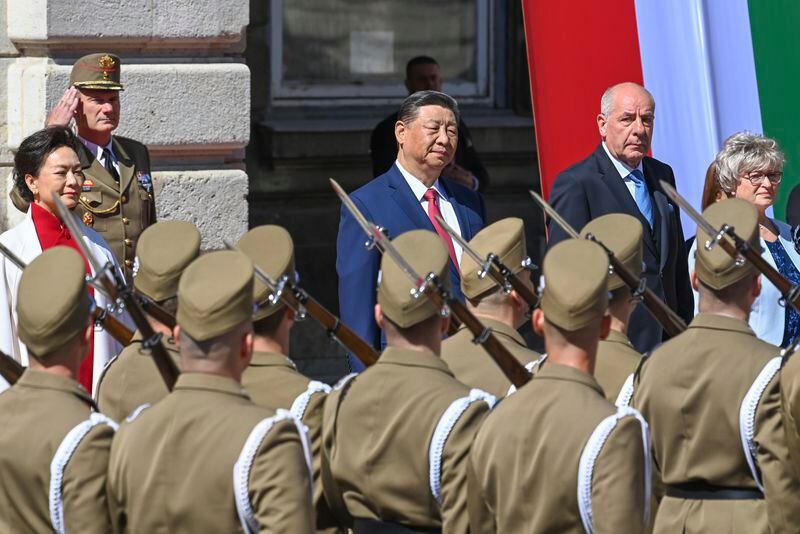 Hungarian President Tamas Sulyok, rear right, receives Chinese President Xi Jinping, rear left, with military honours in the Lion Court of the Castle of Buda in Budapest, Thursday, May 9, 2024. (Zoltan Mathe/MTI via AP)