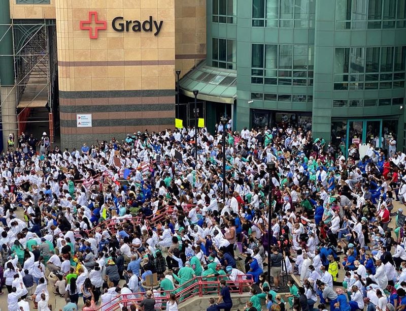 The demostration also happened at Grady Hospital, which is staffed by Emory University doctors. More than 500 physicians, nurses, and staff from across departments at Grady Memorial Hospital knelt for eight minutes and 46 seconds on Friday. Grady officials said teams from each of its neighborhood health centers and infectious disease center took part. SPECIAL TO THE AJC