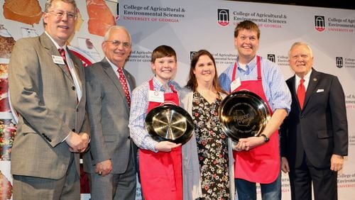 UGA College of Agricultural and Environmental Sciences Dean and Director Sam Pardue, Georgia Commissioner of Agriculture Gary Black congratulate Drew, Melody and David Goodson with Governor Nathan Deal after they won the grand prize at UGA's 2018 Flavor of Georgia Food Product Contest.