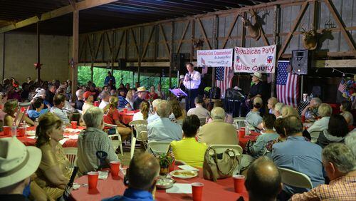 Ohio Gov. John Kasich, who is contemplating a White House bid, speaks at the the Walton County barbecue at Nunnally Farm in Monroe on Tuesday. Brant Sanderlin, bsanderlin@ajc.com
