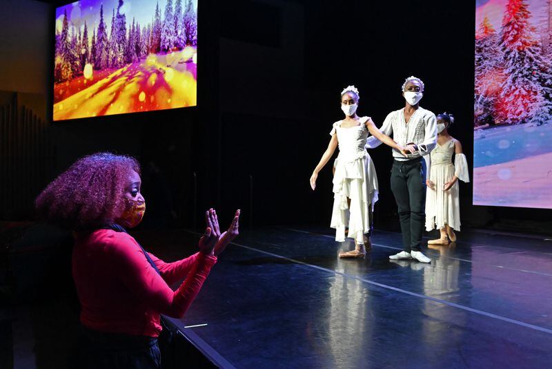 Nena Gilreath (left), co-founder of Ballethnic Dance Company, instructs lead dancers Karla Tyson (center left) and Calvin Gentry (center right) during  BallethnicÕs Urban Nutcracker Experience which is being recorded at The Legacy Theater At Phase Family Center in Alpharetta on Friday, Dec. 4, 2020. (Hyosub Shin / Hyosub.Shin@ajc.com)