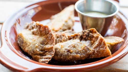 The plantain empanadas at Porch Light Latin Kitchen have a decidedly rustic appearance. CONTRIBUTED BY HENRI HOLLIS