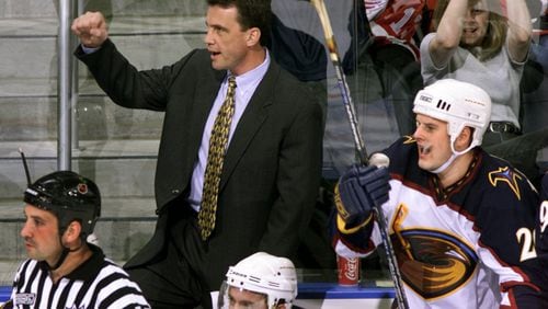 Way back before the purge, Thrashers' head coach Curt Fraser cheers on his guys behind the Atlanta bench. (JOEY IVANSCO/staff photo).