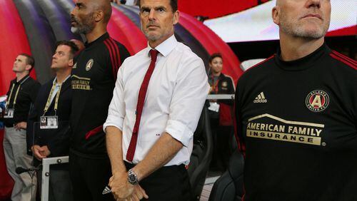 Atlanta United head coach Frank de Boer (center) and assistant coaches take the bench for the game against Orlando City in a MLS soccer match on Sunday, May 12, 2019, in Atlanta.  Curtis Compton/ccompton@ajc.com