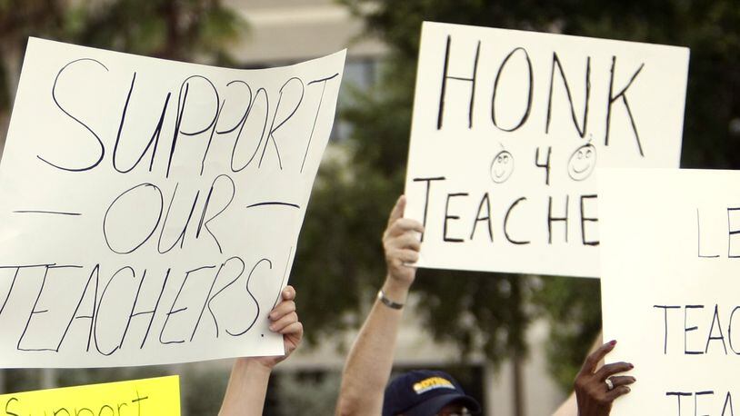 Report: teacher pay gap widens. (AJC File Photo)