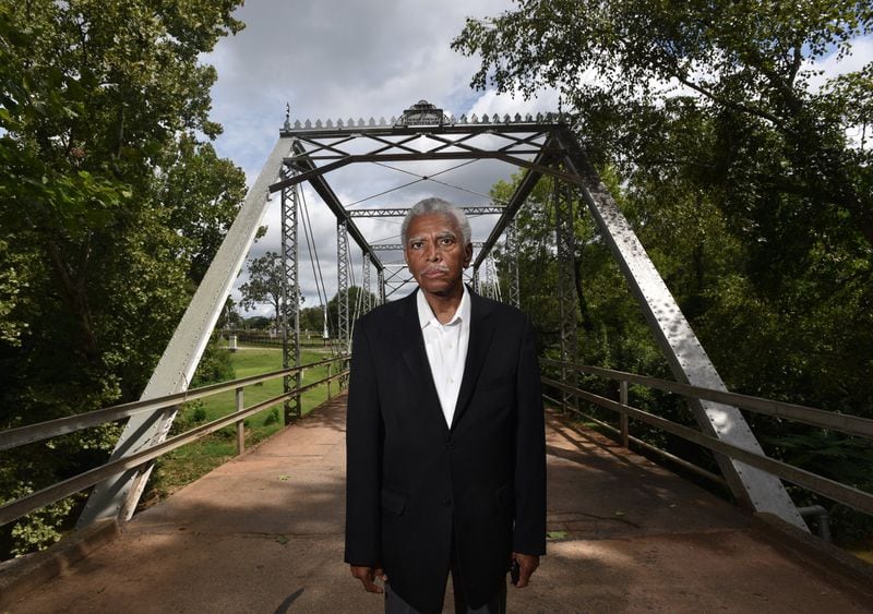 Fred Smith at a bridge in Oconee Hill Cemetery in Athens where slave remains once buried on the nearby University of Georgia campus were reinterred in March 2017. Smith, a UGA alumnus, has been urging university officials since the remains were discovered in 2015 to offer a proper memorial that recognizes the slaves and their contributions to the university in its early decades. A granite memorial recognizing the individuals and other slaves is slated to be installed on the front lawn of Baldwin Hall during fall semester. HYOSUB SHIN / HSHIN@AJC.COM