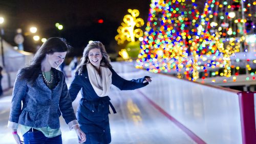 Maggie Daley (left) and Ashlyn Stallings ice skate at Atlantic Station in Midtown. JONATHAN PHILLIPS / SPECIAL