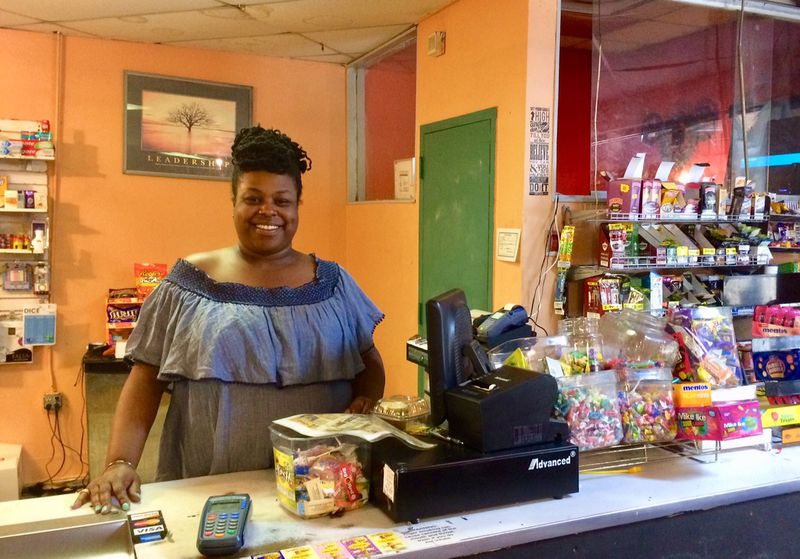 Chloe Floyd runs the Pyramid Grocery store at Floyd’s Plaza in Atlanta's Pittsburgh community. She says the family gets lots of offers from investors but is not interested. Photo by Bill Torpy