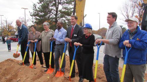 Decatur commissioners and staffers gather for Monday’s ceremonial grounbreaking of a mixed use development that will include 95 affordable senior independent living units, 345 market rate apartments and 22,000 square feet of retail/restaurant. Decatur Mayor Patti Garrett’s in the hard hat and Bill Floyd (far left) was mayor in 2003 when the city began eyeing this site, the Avondale MARTA station, for possible re-development. Photo couresty of Greg White