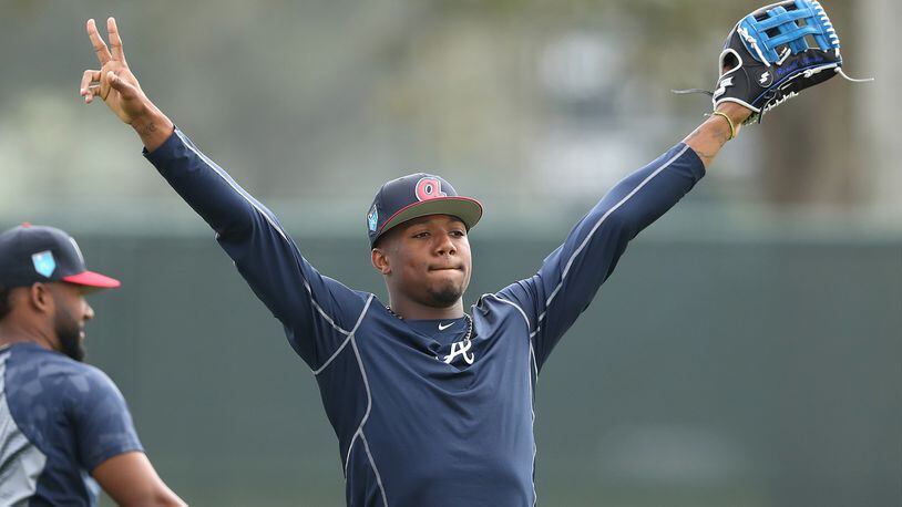Braves outfielder Ronald Acuna, rated the consensus No. 1 prospect in baseball this winter by several experts, works in the outfield in spring training at Disney’s Wide World of Sports complex in Lake Buena Vista, Fla.