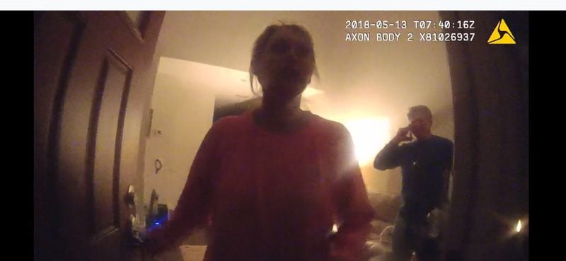 Katie Kettles Sasser at her front door the night of May 13 as officers answer a domestic incident involving her estranged husband Lt. Robert C. Sasser. This photo is from police body cam footage. The man in the background is John Hall Jr. Both Kettles Sasser and Hall were fatally shot by Lt. Sasser on June 28 at Hall’s home. Sasser then killed himself with a gunshot in a SWAT incident at his home. Source: Glynn County Police body cam