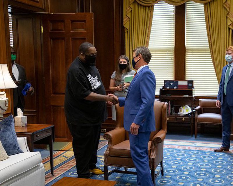 Gov. Brian Kemp greets Atlanta hip-hop star Killer Mike in his ceremonial office. Credit: Kemp's office.