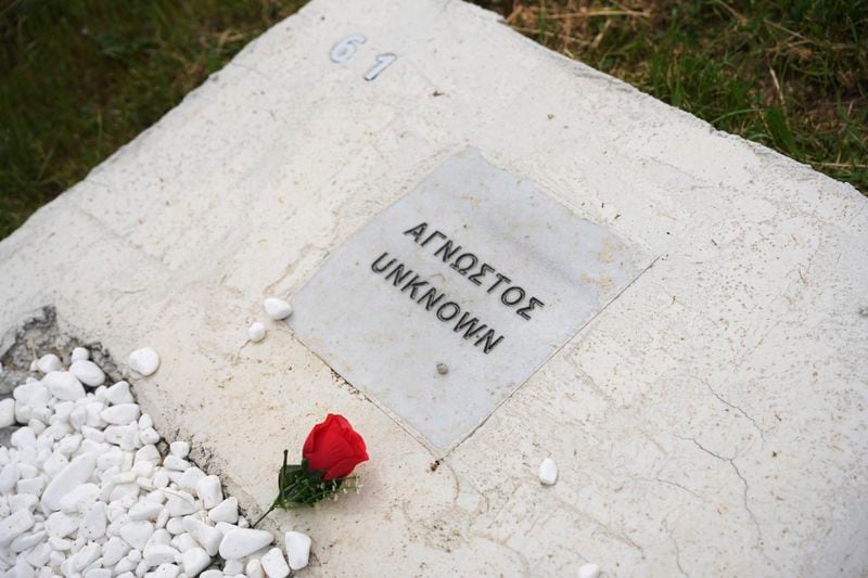 A grave of an unknown refugee is seen at the cemetery in Kato Tritos village on the northeastern Aegean Sea island of Lesbos, Greece, on Wednesday, April 17, 2024. After years of neglect, a primitive burial ground for refugees who died trying to reach Greece's island of Lesbos has been cleaned up and redesigned to provide a dignified resting place for the dead. (AP Photo/Panagiotis Balaskas)