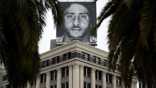 A billboard featuring former San Francisco 49ers quaterback Colin Kaepernick is displayed on the roof of the Nike Store in San Francisco.
