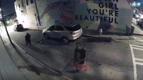 Atlanta police need help identifying the two men seen in this still of security footage after an exchange of gunfire along Peters Street near the Escobar Restaurant & Tapas on Sept. 2.