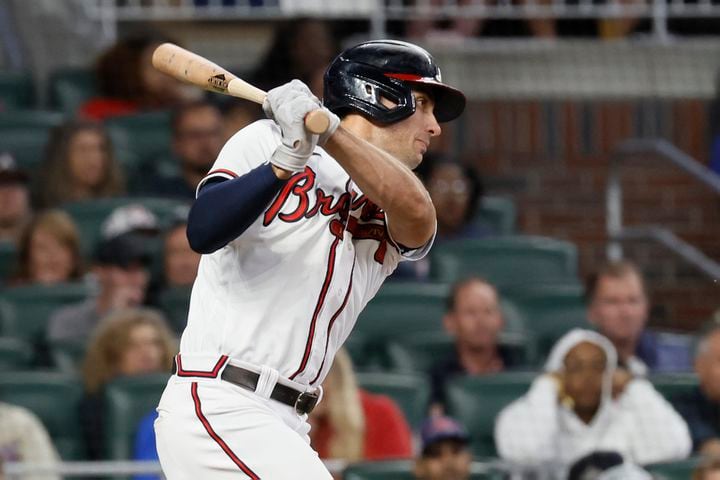Atlanta Braves first baseman Matt Olson (28) hits an  RBI single to tie the game 1-1 during the fourth inning of a baseball game against the New York Mets at Truist Park on Saturday, Oct. 1, 2022. Miguel Martinez / miguel.martinezjimenez@ajc.com
 