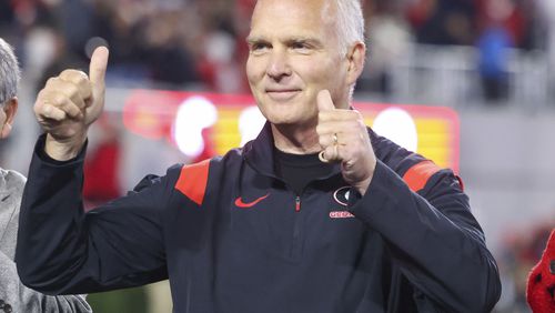Former Georgia head coach Mark Richt is honored after the first quarter of Georgia’s game against Ole Miss at Sanford Stadium on Nov. 11 in Athens. (Jason Getz / Jason.Getz@ajc.com)