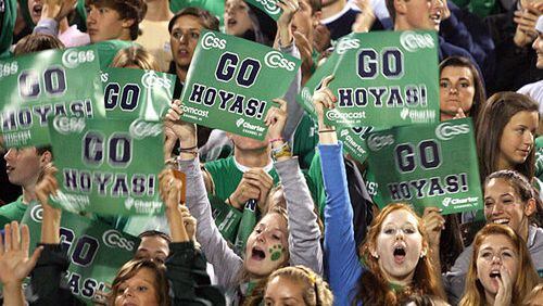 Let's go, Hoyas! The home crowd is fired up for Friday night's region clash between host Harrison and the East Paulding Raiders.